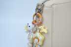 Ciondolo kawaii con anello arancione agganciato alla borsa