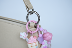 Ciondolo kawaii rosa/lilla agganciato alla borsa